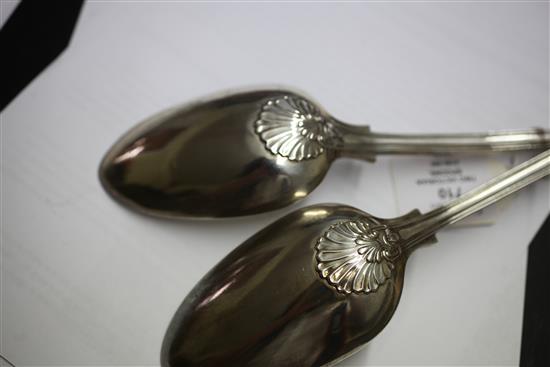 A matched pair of Victorian silver double struck scroll rosette pattern basting spoons, 12.5 oz.